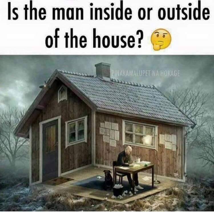 man inside outside house